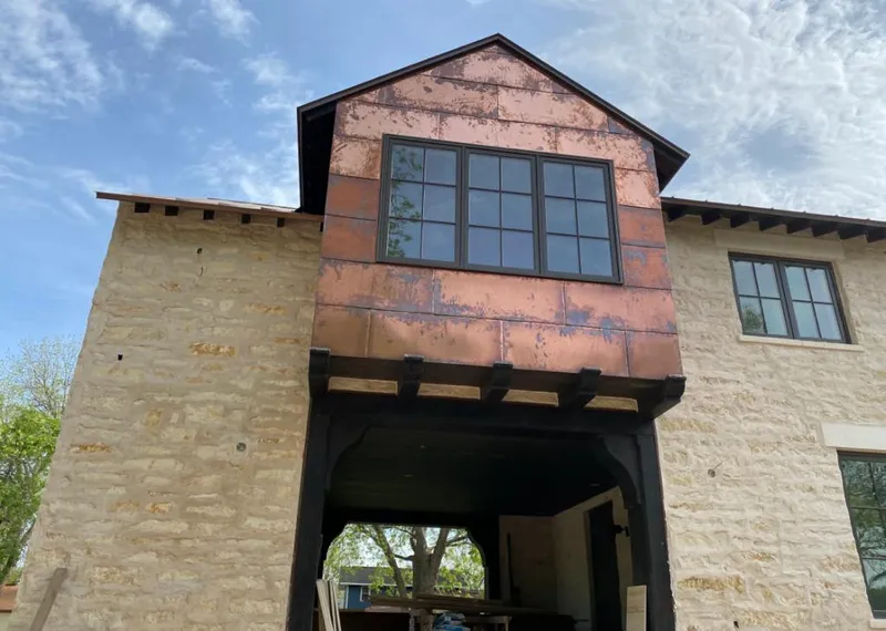 Copper metal panel facade on a stone building for Skylight Installation in Grandview Heights