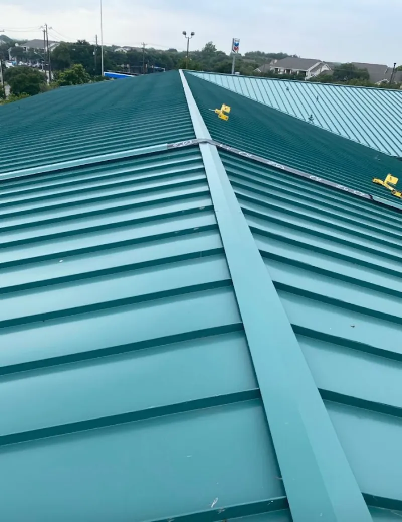 Green commercial metal roof ridge and valley for Metal Roof Repair in Grandview Heights