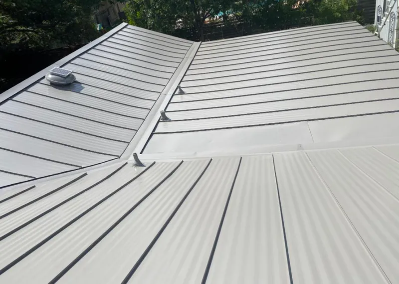 Solar attic fan installed on a metal roof for Roof Ventilation in Grandview Heights